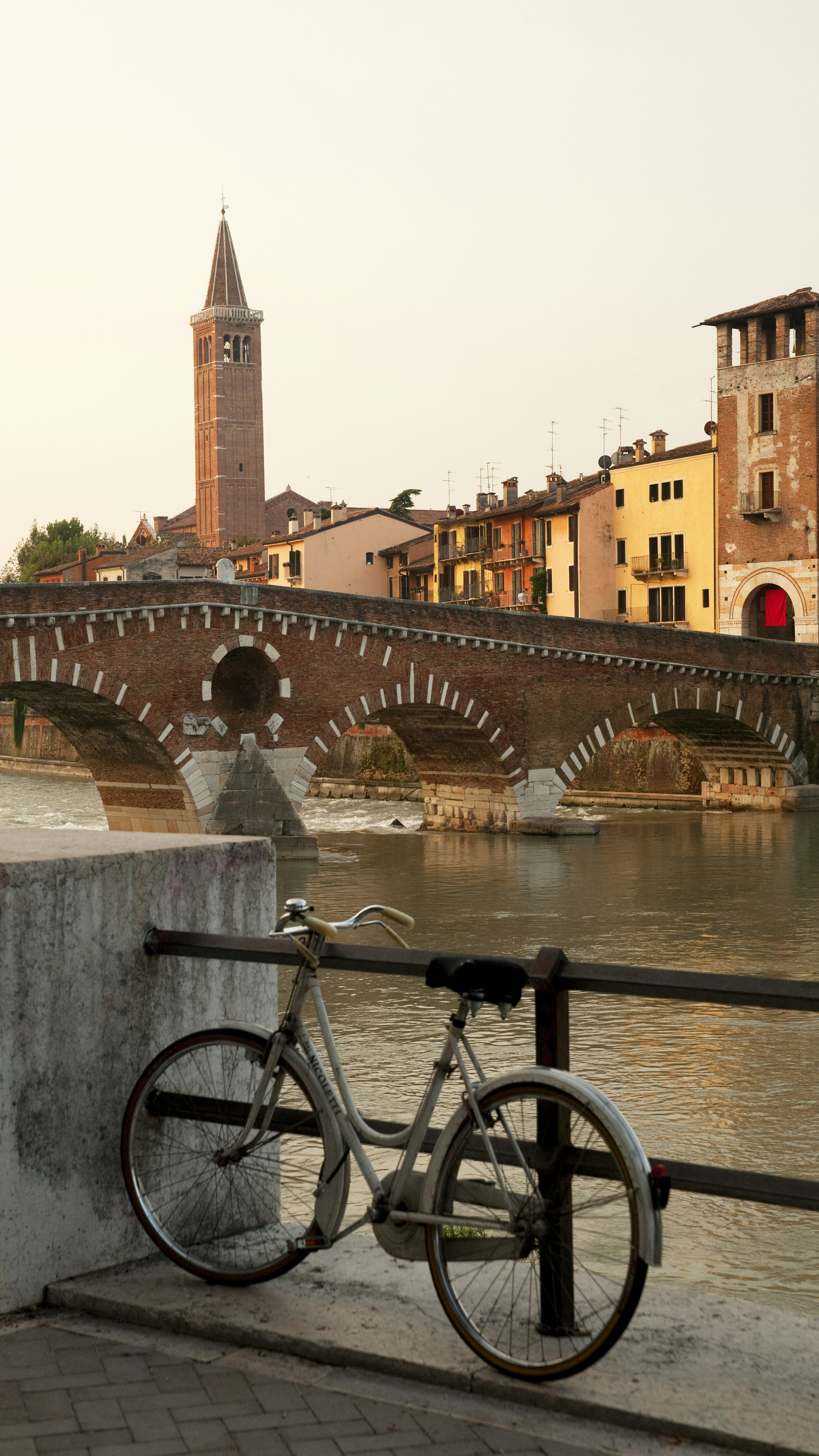 Bicycle parked on Ponte Pietra bridge in Verona